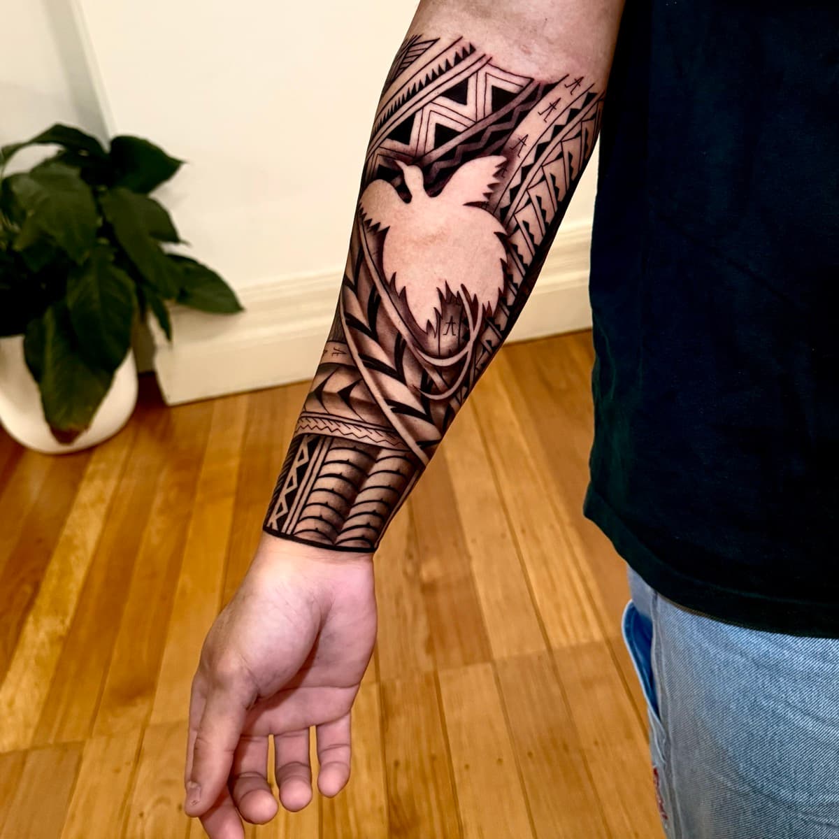 Fresh tattoo being wrapped with second skin film at Memento Tattoo