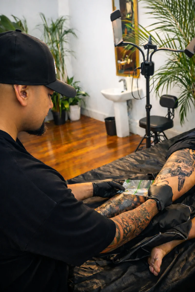 Applying Second Skin protective film to a freshly completed tattoo